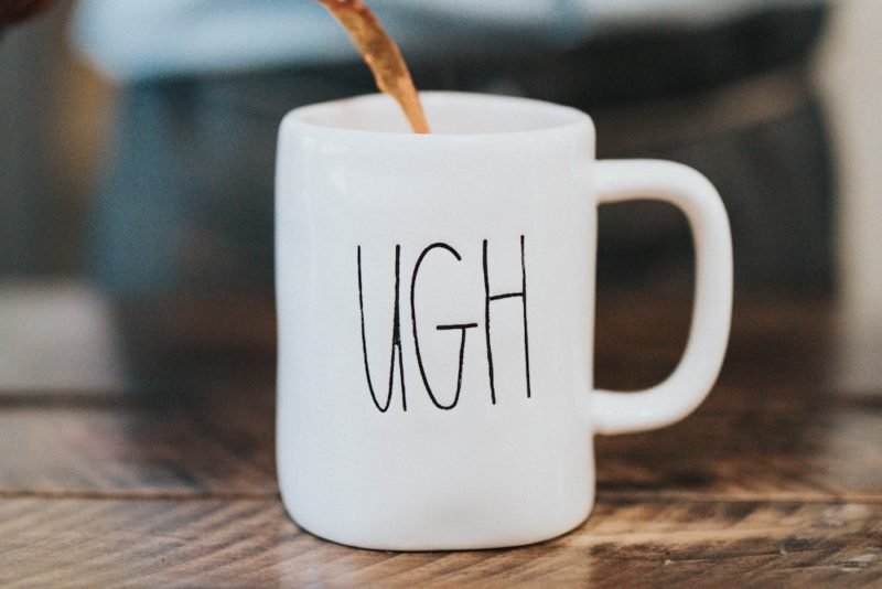 Weight stigma exercise: Photo of a white coffee mug that reads "UGH" in black letters. This is how I feel when a client in a larger body tells me their doctor doesn't believe they exercise.