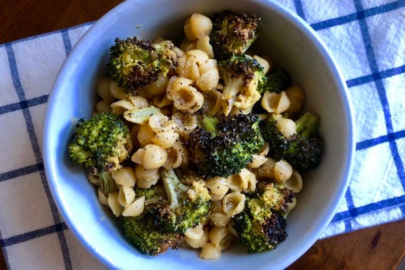 Hack your mac: photo of mac and cheese with roasted broccoli and some sriracha and black pepper.