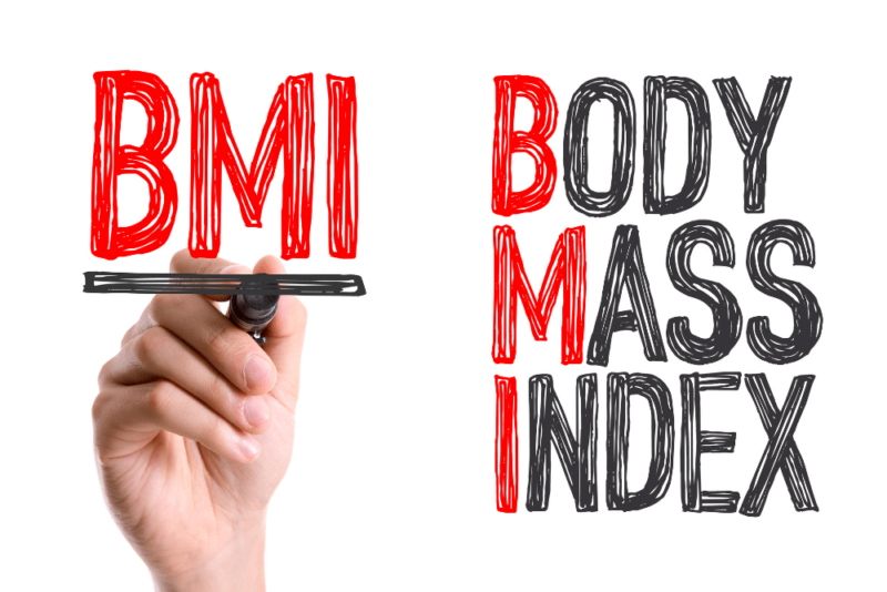 Does BMI equal health? Image of the words Body Mass Index drawn in red and black felt tip marker, with someone's hand finishing drawing a black underline under the word "BMI" drawn in red marker.