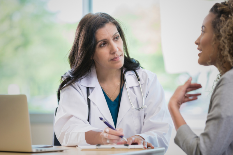 Woman talking to her doctor.