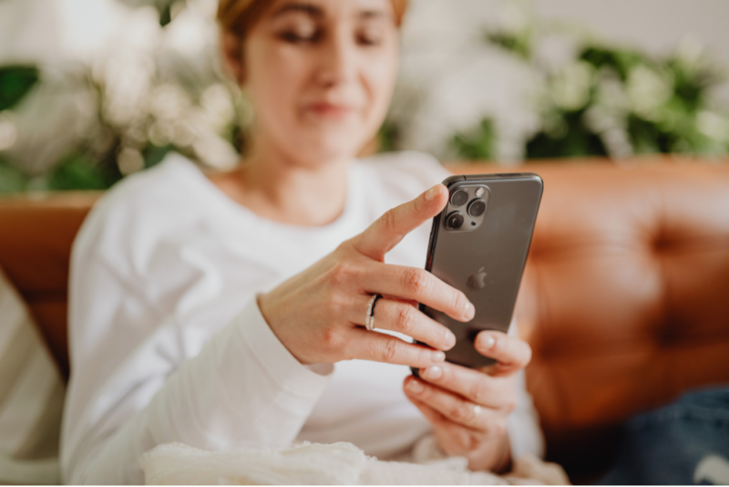 A woman scrolling on her phone